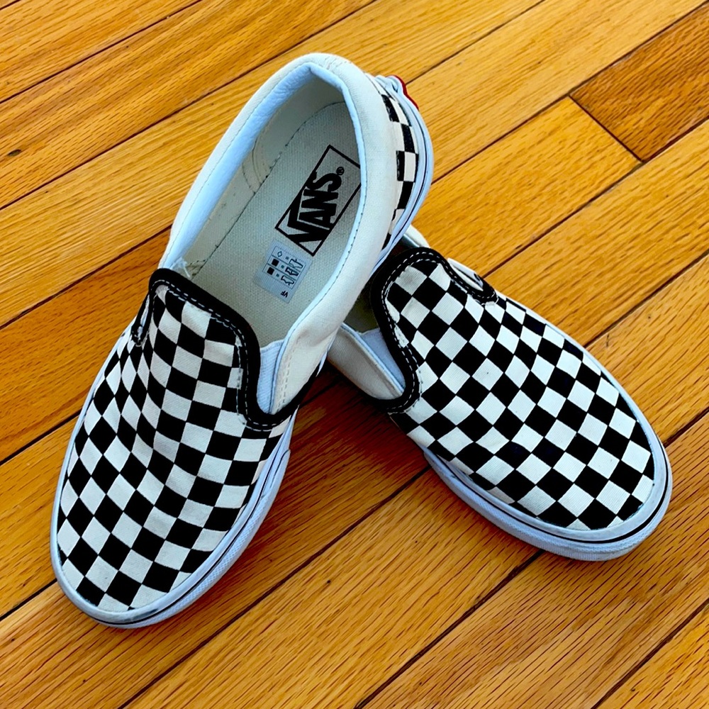 Kids black and white checkered Vans sneakers